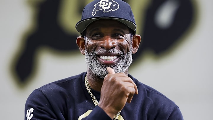 Colorado Buffaloes head coach Deion Sanders watches as his players go through drills at the University of Colorado NFL Showcase at the CU Indoor Practice Facility.