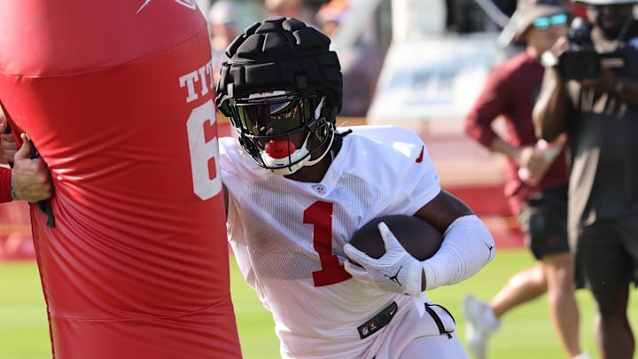 Tampa Bay Buccaneers running back Rachaad White works out during training camp at AdventHealth Training Center. Tampa Bay Buccaneers running back Rachaad White works out during training camp at AdventHealth Training Center.