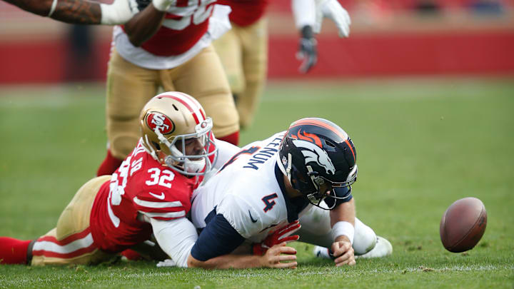 San Francisco 49ers cornerback D.J. Reed (32) forces a fumble on Denver Broncos quarterback Case Keenum (4)