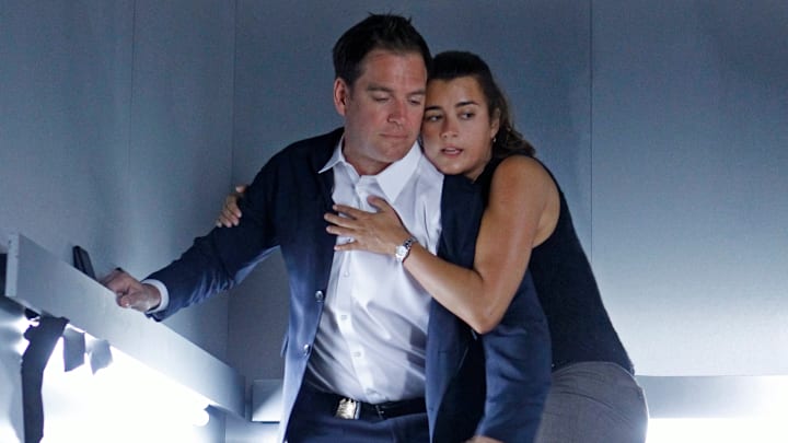 "Extreme Prejudice" -- Harper Dearing’s latest act of terrorism ripped through NCIS headquarters in last season’s cliffhanger finale, sparking a cross-agency manhunt for the criminal mastermind on the 10th season premiere of NCIS, Tuesday, Sept. 25 (8:00-9:00 PM, ET/PT) on the CBS Television Network. Pictured left to right: Michael Weatherly and Cote de Pablo Photo: Monty Brinton/CBS 
©2012 CBS Broadcasting Inc. All Rights Reserved.
