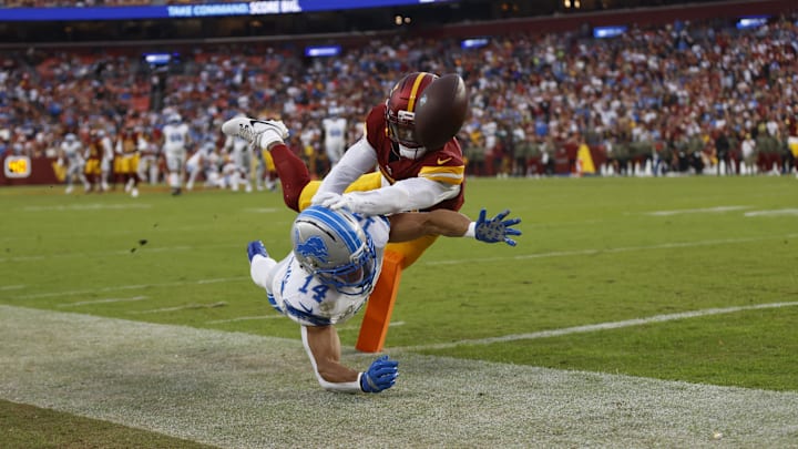 Nov 9, 2025; Landover, Maryland, USA; Washington Commanders cornerback Jonathan Jones (31) breaks up a pass intended for Detroit Lions wide receiver Amon-Ra St. Brown (14) during the first quarter at Northwest Stadium. 