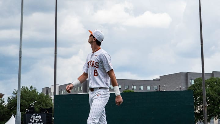 Texas Longhorns outfielder Will Gasparino (8) eyes the clouds above the field as the Longhorns prepare to take on the Florida Gators in Austin, May 10, 2025.