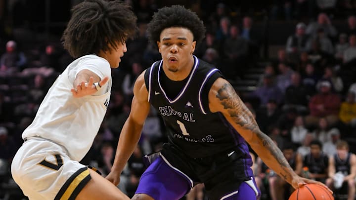 Dec 13, 2025; Nashville, Tennessee, USA; Central Arkansas Bears guard Camren Hunter (1) dribbles the ball past Vanderbilt Commodores guard Tyler Tanner (3).
