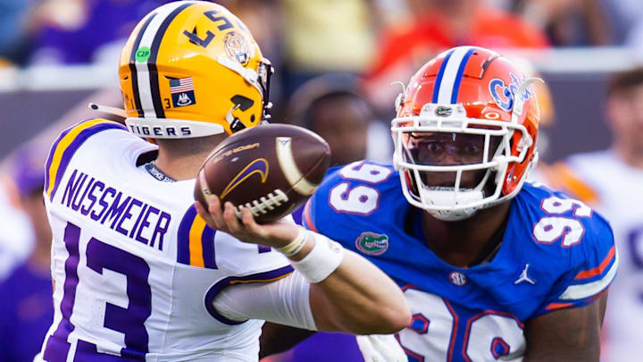 Florida Gators defensive lineman Cam Jackson (99) pressures LSU Tigers quarterback Garrett Nussmeier (13) during the first half at Ben Hill Griffin Stadium in Gainesville, FL on Saturday, November 16, 2024. [Doug Engle/Gainesville Sun]