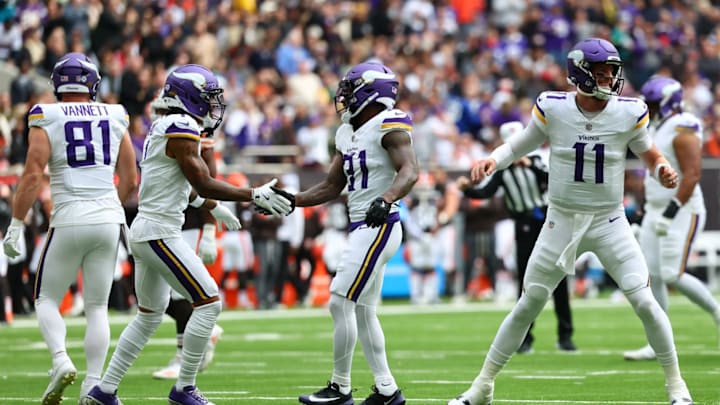 Cam Akers (31) celebrates his touchdown pass alongside quarterback Carson Wentz (11). 