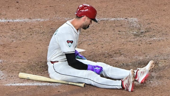 Jun 27, 2024; Phoenix, Arizona, USA;  Arizona Diamondbacks shortstop Blaze Alexander (9) reacts after being hit by a pitch in the ninth inning against the Minnesota Twins at Chase Field. Mandatory Credit: Matt Kartozian-Imagn Images