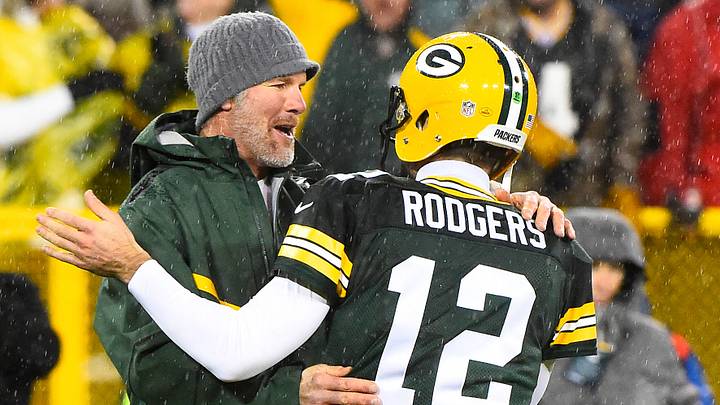 Nov 26, 2015; Green Bay, WI, USA; Green Bay Packers former quarterback Brett Favre hugs Green Bay Packers quarterback Aaron Rodgers (12) at half time for a NFL game against the Chicago Bears on Thanksgiving at Lambeau Field. Mandatory Credit: Mike DiNovo-USA TODAY Sports