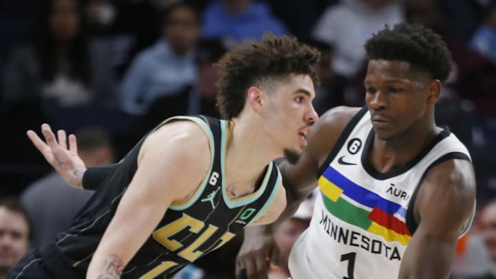 Feb 24, 2023; Minneapolis, Minnesota, USA; Charlotte Hornets guard LaMelo Ball (1) works past Minnesota Timberwolves forward Anthony Edwards (1) in the third quarter at Target Center. Mandatory Credit: Bruce Kluckhohn-Imagn Images