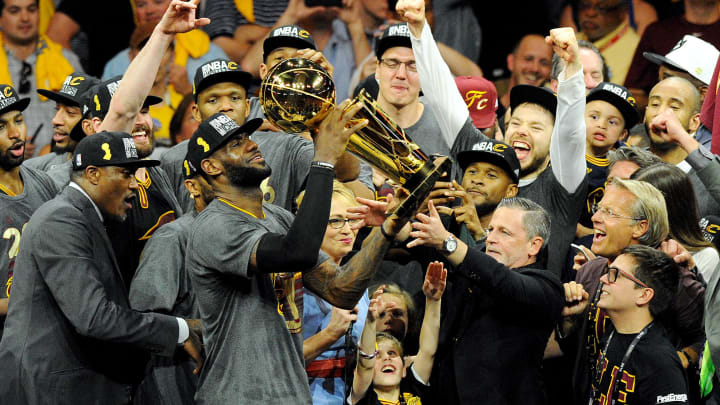 Jun 19, 2016; Oakland, CA, USA; Cleveland Cavaliers forward LeBron James (23) celebratew with the Larry O'Brien Championship Trophy after beating the Golden State Warriors in game seven of the NBA Finals at Oracle Arena. Mandatory Credit: Gary A. Vasquez-USA TODAY Sports