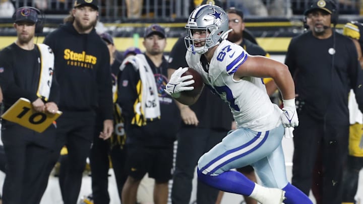 Dallas Cowboys tight end Jake Ferguson runs after catch against the Pittsburgh Steelers during the second quarter at Acrisure Stadium. 