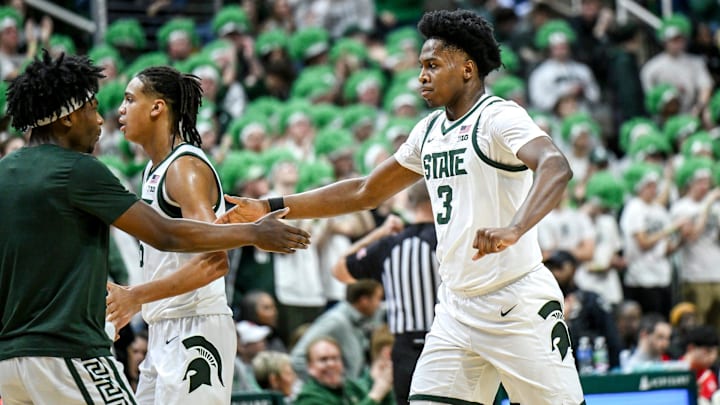 Michigan State's Cam Ward, right, celebrates his dunk with Trey Fort during a timeout in the first half in the game against Rutgers on Thursday, March 5, 2026, at the Breslin Center in East Lansing.