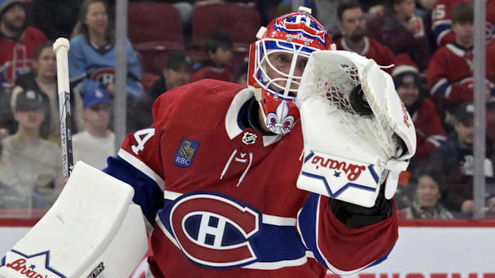 Feb 11, 2024; Montreal, Quebec, CAN; Montreal Canadiens goalie Jake Allen (34) makes a glove save