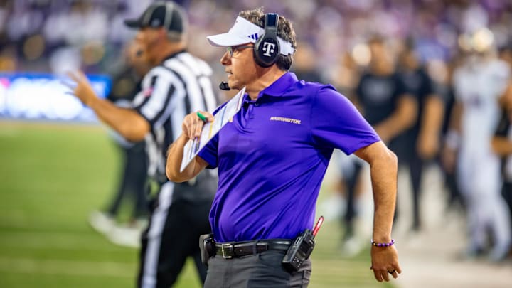 Jedd Fisch does a hip swivel as the Huskies convert an Apple Cup play. 