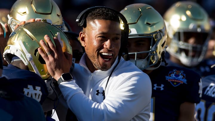 Notre Dame head football coach Marcus Freeman celebrates at the 90th annual Sun Bowl game against