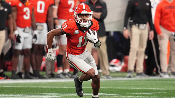 Dec 7, 2024; Atlanta, GA, USA; Georgia Bulldogs wide receiver Arian Smith (11) makes a catch against the Texas Longhorns during the second half in the 2024 SEC Championship game at Mercedes-Benz Stadium. Mandatory Credit: Dale Zanine-Imagn Images