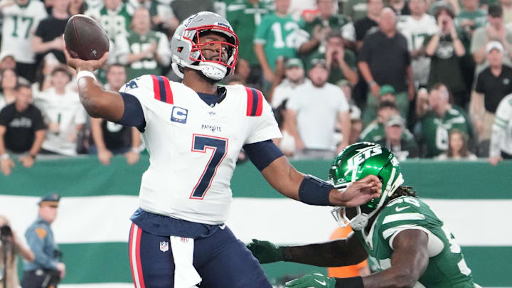 Sep 19, 2024; East Rutherford, New Jersey, USA;  New York Jets linebacker Quincy Williams (56)  rushes New England Patriots quarterback Jacoby Brissett (7)  in the 1st quarter at MetLife Stadium.