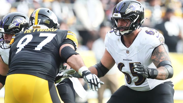 Nov 17, 2024; Pittsburgh, Pennsylvania, USA;  Baltimore Ravens guard Patrick Mekari (65) blocks at the line of scrimmage against Pittsburgh Steelers defensive tackle Cameron Heyward (97) during the first quarter at Acrisure Stadium. Mandatory Credit: Charles LeClaire-Imagn Images