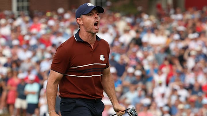 [Team Europe's Rory McIlroy celebrates after holing his putt on the 14th hole during the four-balls on the second day of competition for the Ryder Cup at Bethpage Black.