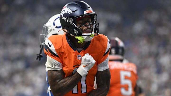 Sep 14, 2025; Indianapolis, Indiana, USA; Denver Broncos wide receiver Troy Franklin (11) celebrates scoring a touchdown during the second quarter against the Indianapolis Colts at Lucas Oil Stadium.