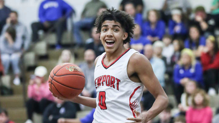 Newport's Taylen Kinney (0) reacts after scoring two of his 13 points in the first half against Washington County at Wednesday's 2023 King of the Bluegrass basketball tournament at Fairdale High School. Dec. 20, 2023
