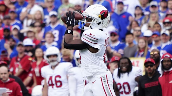 Sep 8, 2024; Orchard Park, New York, USA; Arizona Cardinals wide receiver Greg Dortch (4) makes a catch against the Buffalo Bills during the first half at Highmark Stadium. Mandatory Credit: Gregory Fisher-Imagn Images