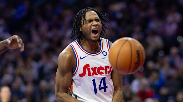 Jan 28, 2025; Philadelphia, Pennsylvania, USA; Philadelphia 76ers guard Ricky Council IV (14) reacts after his dunk against the Los Angeles Lakers during the fourth quarter at Wells Fargo Center. Mandatory Credit: Bill Streicher-Imagn Images