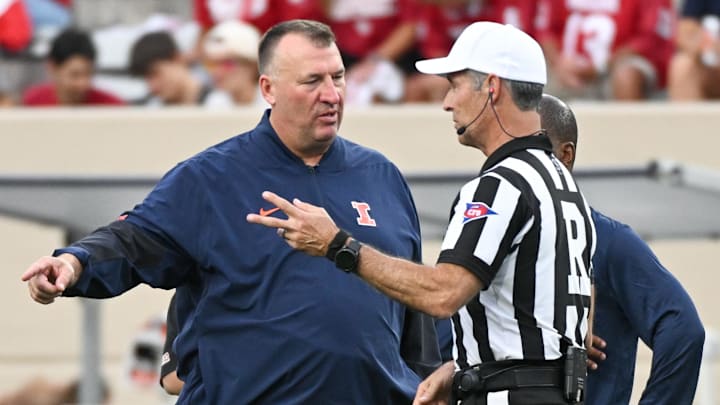 Sep 20, 2025; Bloomington, Indiana, USA; Illinois Fighting Illini head coach Bret Bielema talks to a referee prior to the game against the Indiana Hoosiers at Memorial Stadium. Mandatory Credit: Robert Goddin-Imagn Images