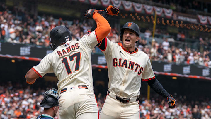 Apr 6, 2025; San Francisco, California, USA; San Francisco Giants designated hitter Heliot Ramos (17) gives for arm bashes to San Francisco Giants right fielder Mike Yastrzemski (5).