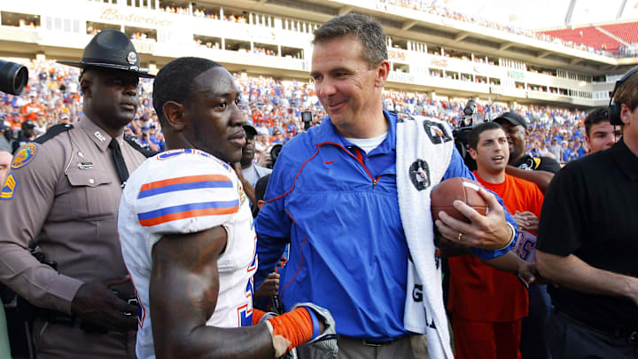 January 1, 2011; Tampa, FL, USA;  Florida Gators head coach Urban Meyer smiles with safety Ahmad Black (35) after their game in the 2011 Outback Bowl at Raymond James Stadium. Florida Gators defeated the Penn State Nittany Lions 37-24. Mandatory Credit: Kim Klement-Imagn Images