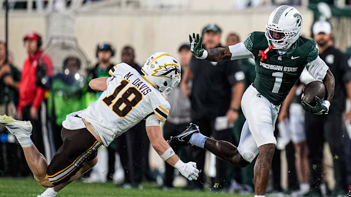 Michigan State wide receiver Omari Kelly (1) runs against Western Michigan safety Micah Davis (18) during the first half at Spartan Stadium in East Lansing on Friday, August 29, 2025.