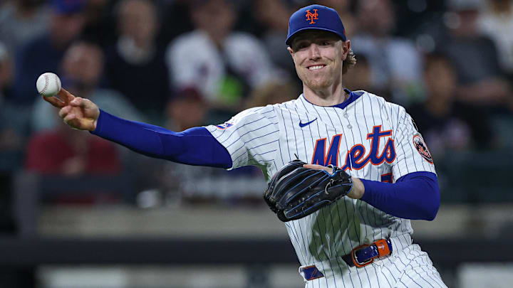 Sep 17, 2025; New York City, New York, USA; New York Mets third baseman Brett Baty (7) throws the ball to first base for an out during the first inning against the San Diego Padres  at Citi Field. Mandatory Credit: Vincent Carchietta-Imagn Images