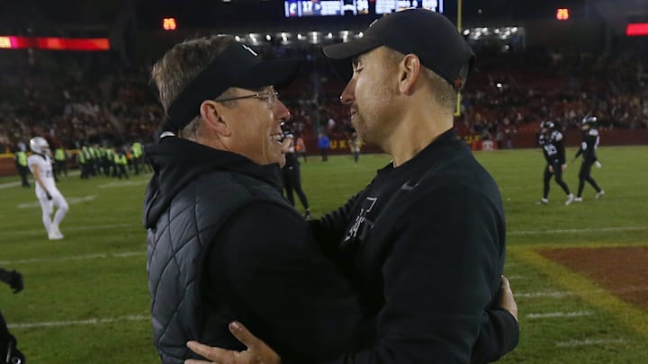 Iowa State head football coach Matt Campbell and Cincinnati coach Scott Satterfield talk after a win by the Cyclones Saturday night in Ames.