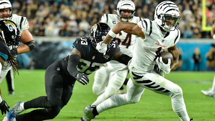 Jacksonville Jaguars linebacker Devin Lloyd (33) chases down Cincinnati Bengals wide receiver Ja'Marr Chase (1), making the tackle just short of the goal line during early fourth quarter action. The Jacksonville Jaguars hosted the Cincinnati Bengals at EverBank Stadium in Jacksonville, Florida for Monday Night Football, December 4, 2023. The Jaguars were tied 14 to 14 at the end of the first half an fell in overtime with a final score of 34 to 31. [Bob Self/Florida Times-Union]