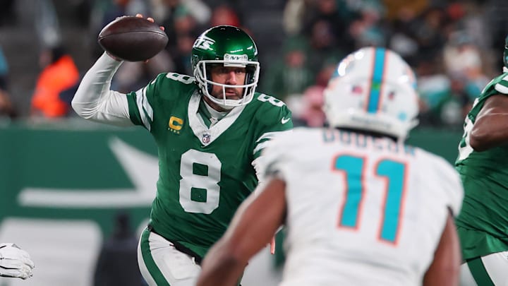 Jan 5, 2025; East Rutherford, New Jersey, USA; New York Jets quarterback Aaron Rodgers (8) looks to pass during the third quarter of their game against the Miami Dolphins at MetLife Stadium. Mandatory Credit: Ed Mulholland-Imagn Images