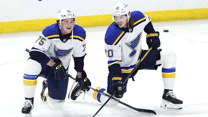 Apr 7, 2025; Winnipeg, Manitoba, CAN; St. Louis Blues defenseman Tyler Tucker (75) and St. Louis Blues center Oskar Sundqvist (70) talk before a game against the Winnipeg Jets at Canada Life Centre. Mandatory Credit: James Carey Lauder-Imagn Images Apr 7, 2025; Winnipeg, Manitoba, CAN; St. Louis Blues defenseman Tyler Tucker (75) and St. Louis Blues center Oskar Sundqvist (70) talk before a game against the Winnipeg Jets at Canada Life Centre. Mandatory Credit: James Carey Lauder-Imagn Images