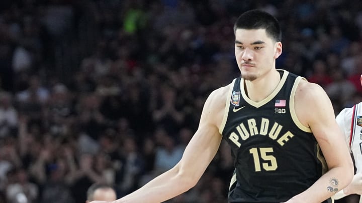 Purdue Boilermakers guard Lance Jones (55) high-fives Purdue Boilermakers center Zach Edey (15) during the NCAA Men’s Basketball Tournament Championship against the Connecticut Huskies, Monday, April 8, 2024, at State Farm Stadium in Glendale, Ariz.