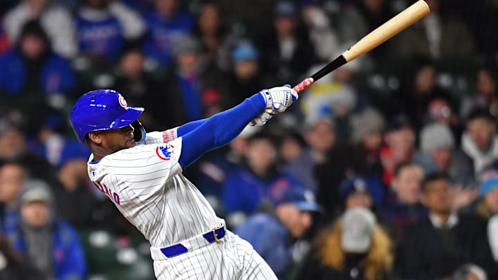 Apr 20, 2024; Chicago, Illinois, USA; Chicago Cubs outfielder Alexander Canario (4) hits a home run during the sixth inning against the Miami Marlins at Wrigley Field. 