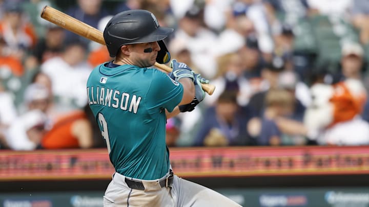 Jul 12, 2025; Detroit, Michigan, USA; Seattle Mariners third baseman Ben Williamson (9) hits an RBI single in the seventh inning against the Detroit Tigers at Comerica Park. Mandatory Credit: Rick Osentoski-Imagn Images