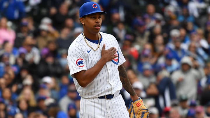 Apr 20, 2024; Chicago, Illinois, USA; Chicago Cubs pitcher Yency Almonte (25) reacts after ending the seventh inning against the Miami Marlins at Wrigley Field