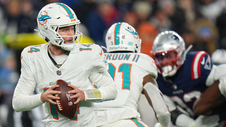 Miami Dolphins quarterback Quinn Ewers (14) drops back to pass against the New England Patriots during the second half at Gillette Stadium in the 2025 regular season finale.
