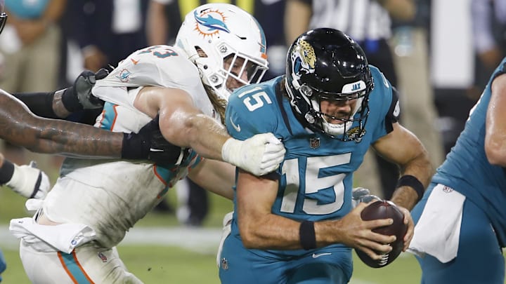 Miami Dolphins outside linebacker Andrew Van Ginkel (43) tackles Jacksonville Jaguars quarterback Gardner Minshew (15) during the second half at TIAA Bank Field in the 2020 season.