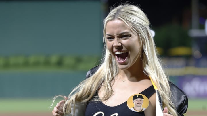 LSU gymnast Livvy Dunne reacts on the field after her boyfriend Pittsburgh Pirates starting pitcher Paul Skenes made his major league debut against the Chicago Cubs at PNC Park. LSU gymnast Livvy Dunne reacts on the field after her boyfriend Pittsburgh Pirates starting pitcher Paul Skenes made his major league debut against the Chicago Cubs at PNC Park.