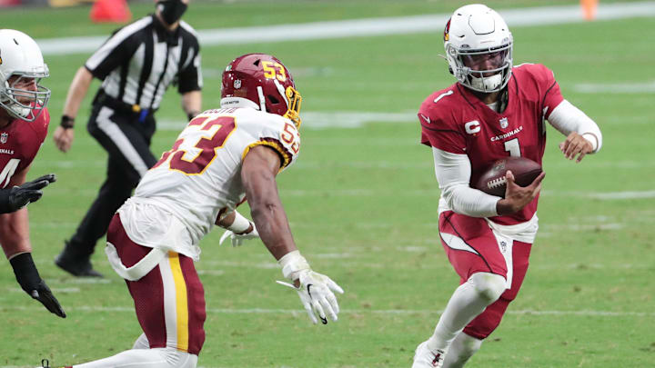 Arizona Cardinals quarterback Kyler Murray (1) runs through an opening Washington Football Team