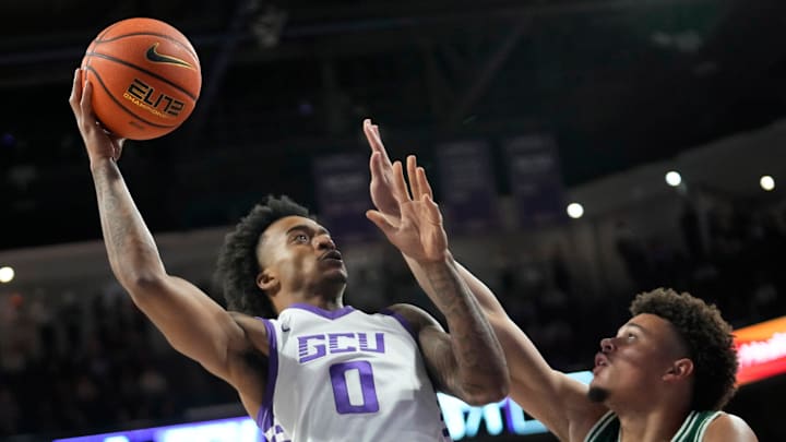 Grand Canyon University guard Ray Harrison (0) shoots over Eastern new Mexico guard Cougar Downing (2) during an exhibition game at Global Credit Union Arena in Phoenix on Oct. 29, 2024.