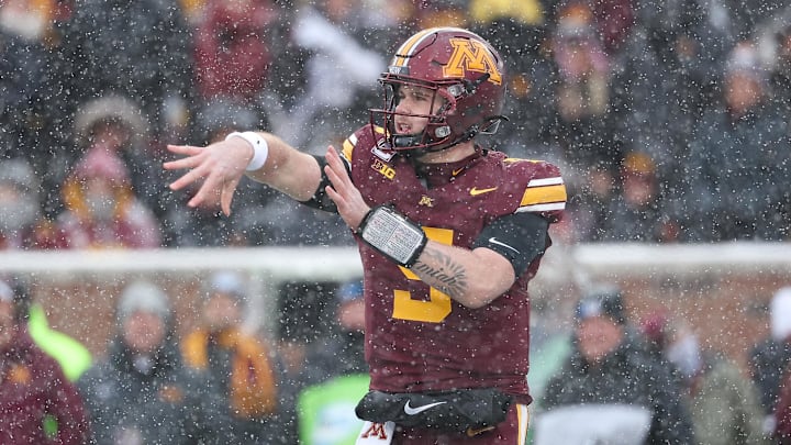 Nov 29, 2025; Minneapolis, Minnesota, USA; Minnesota Golden Gophers quarterback Drake Lindsey (5) throws the ball against the Wisconsin Badgers during the first half at Huntington Bank Stadium. Mandatory Credit: Matt Krohn-Imagn Images
