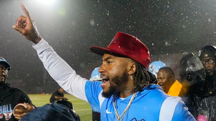 Delaware State head coach DeSean Jackson celebrates his first win as a college head coach after the Hornets' 37-32 win against Albany at Alumni Stadium in Dover, Del. Sept. 6, 2025. Two weather delays stretched the game past seven hours.
