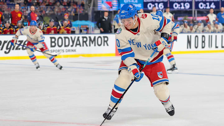 Jan 2, 2026; Miami, Florida, USA; New York Rangers left wing Artemi Panarin (10) controls the puck against the Florida Panthers during the first period in the 2026 Winter Classic ice hockey game at loanDepot Park. Mandatory Credit: Sam Navarro-Imagn Images