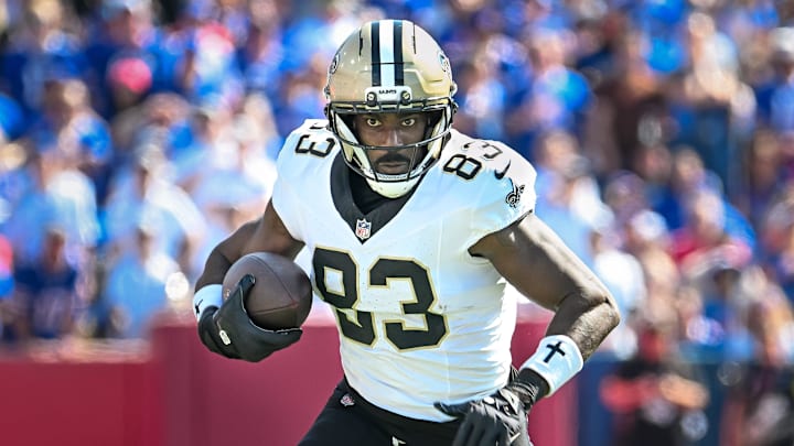 Sep 28, 2025; Orchard Park, New York, USA; New Orleans Saints tight end Juwan Johnson (83) runs after making a catch against the Buffalo Bills in the first quarter at Highmark Stadium. Mandatory Credit: Mark Konezny-Imagn Images