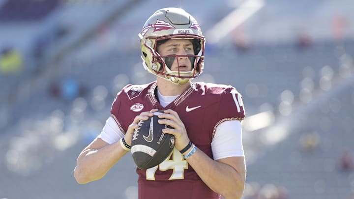 Nov 23, 2024; Tallahassee, Florida, USA; Florida State Seminoles quarterback Luke Kromenhoek (14) warms up before the game against the Charleston Southern Buccaneers at Doak S. Campbell Stadium. Mandatory Credit: Melina Myers-Imagn Images