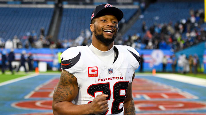 Jan 5, 2025; Nashville, Tennessee, USA;  Houston Texans running back Joe Mixon (28) smiles as he leaves the field against the Tennessee Titans during the second half at Nissan Stadium. Mandatory Credit: Steve Roberts-Imagn Images
